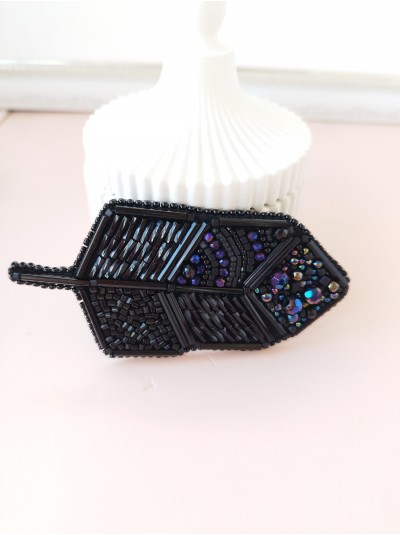 Black feather embroidery brooch.
