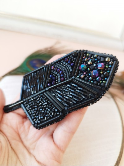 Black feather embroidery brooch.