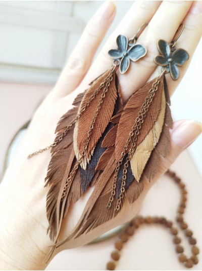 Brown leather feather earrings with chain.