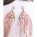 Multi layered earrings made from genuine leather and real feathers.
