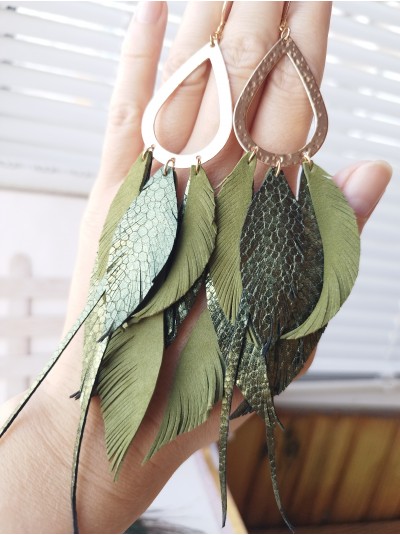 Olive gold extra long leather feather earrings.