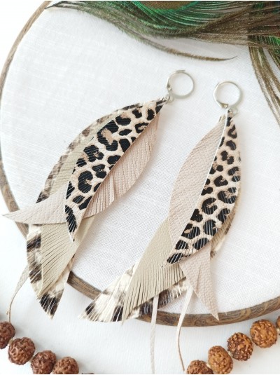 Animal print beige leather feather earrings.  
