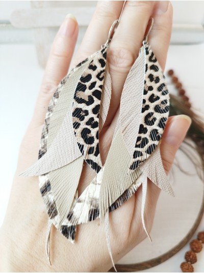 Animal print beige leather feather earrings.  