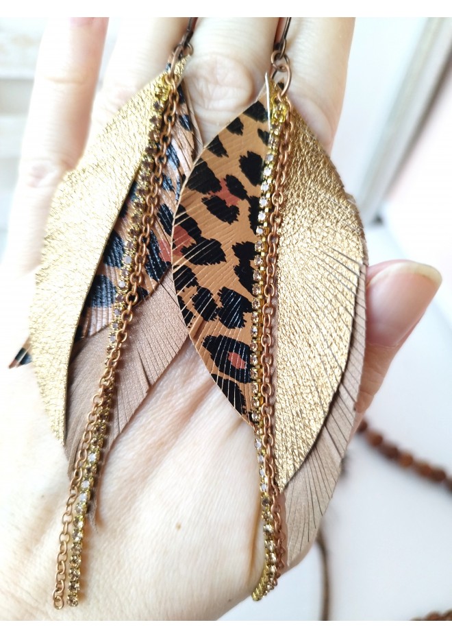 Unique high quality hand cut genuine leather feather earrings.