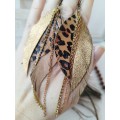Unique high quality hand cut genuine leather feather earrings.