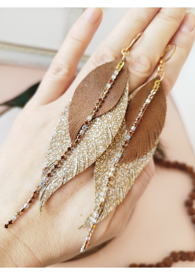 Unique high quality hand cut genuine leather feather earrings.