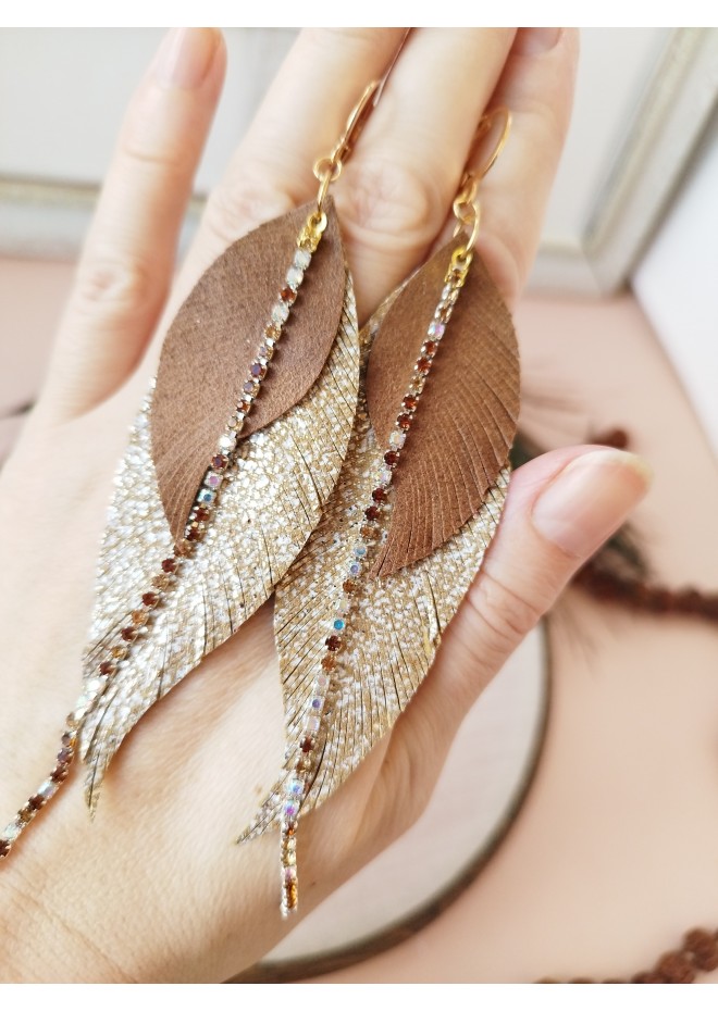 Unique high quality hand cut genuine leather feather earrings.
