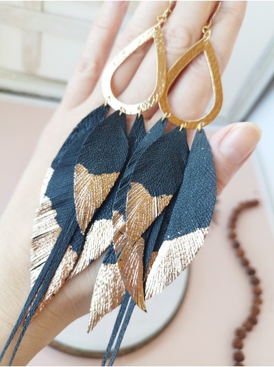 Black gold extra long leather feather earrings.