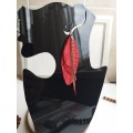 Unique high quality hand cut genuine leather feather earrings.