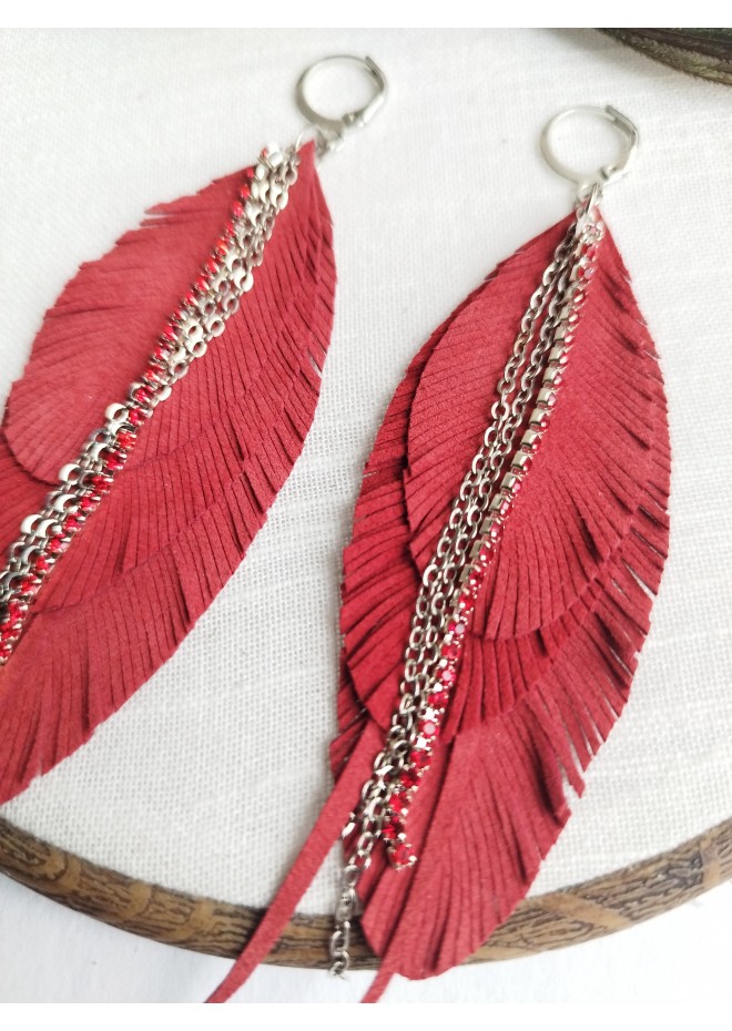 Unique high quality hand cut genuine leather feather earrings.