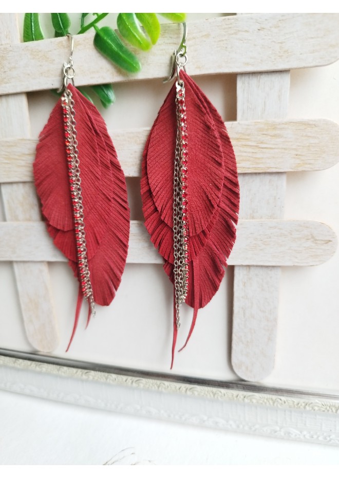 Unique high quality hand cut genuine leather feather earrings.
