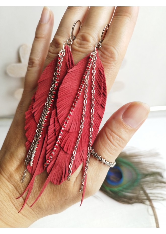 Unique high quality hand cut genuine leather feather earrings.