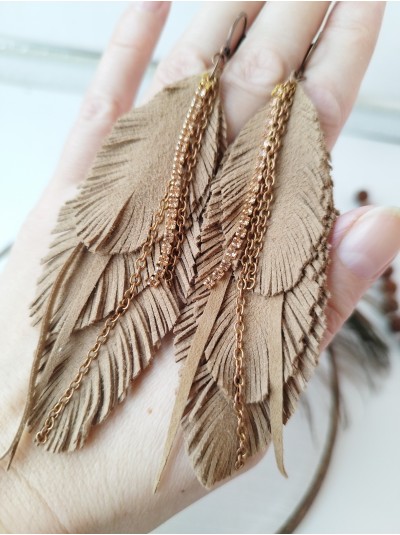 Soft beige with chain leather feather earrings.