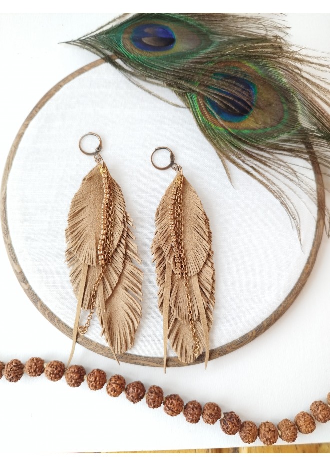 Unique high quality hand cut genuine leather feather earrings.