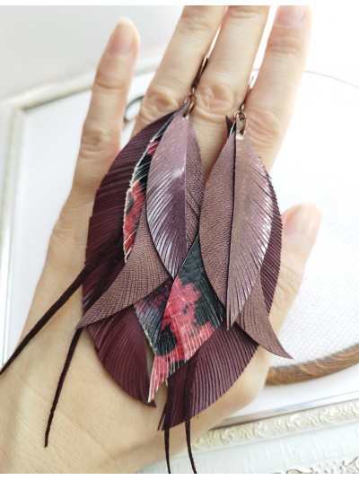 Maroon leather feather earrings.  