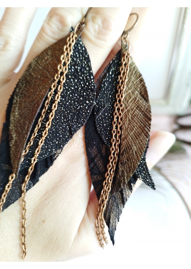 Unique high quality hand cut genuine leather feather earrings.