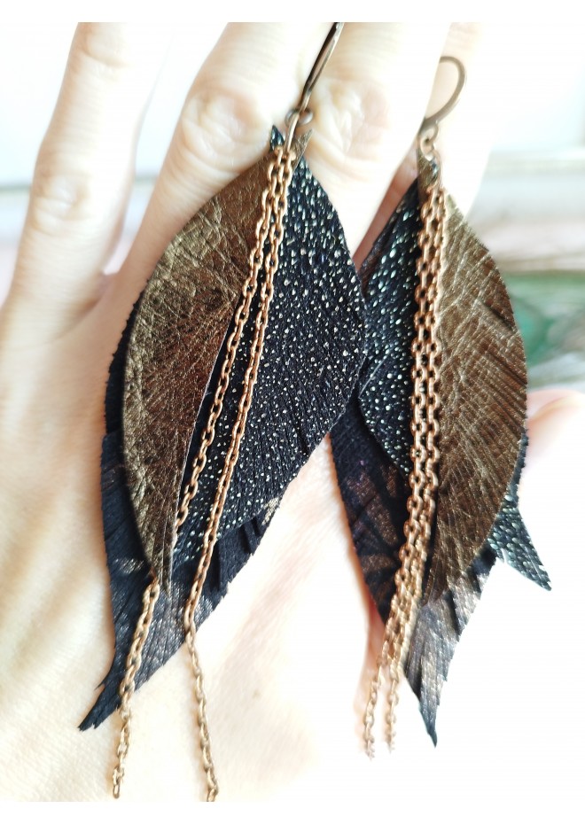 Unique high quality hand cut genuine leather feather earrings.