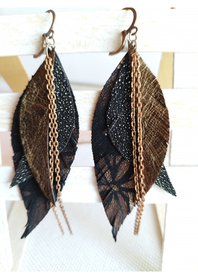 Unique high quality hand cut genuine leather feather earrings.