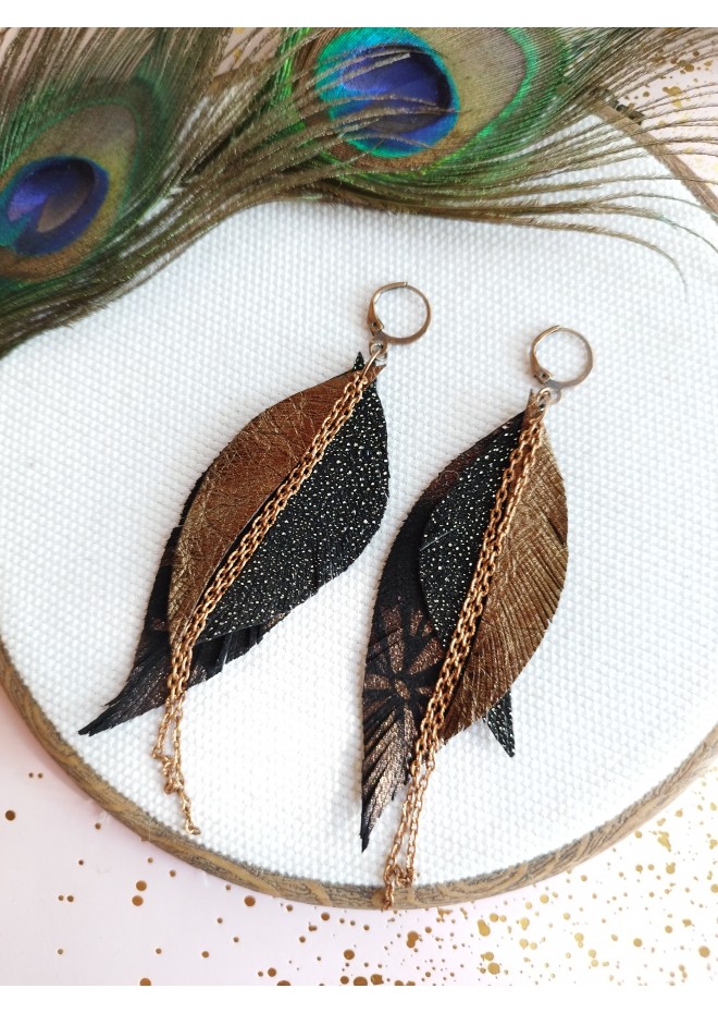 Unique high quality hand cut genuine leather feather earrings.