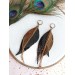 Unique high quality hand cut genuine leather feather earrings.