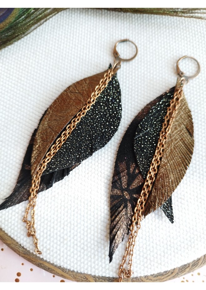 Unique high quality hand cut genuine leather feather earrings.